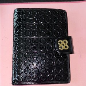 Black Embossed COACH Planner with Gold Accent